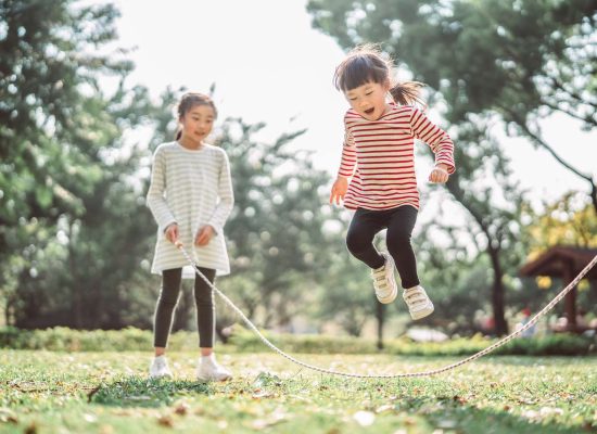 young-family-jumping-rope-joyfully-on-the-lawn-1215744796-08b5ef6c45c647f3aece9fc24948caf8